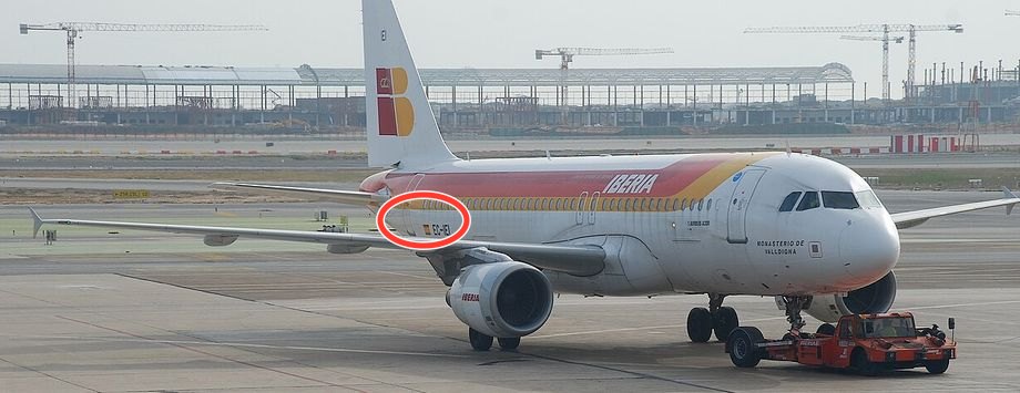 An Iberia Airbus A320 with its registration EC-IEI circled on the rear fuselage